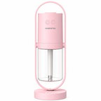 Pink portable humidifier with a clear water tank on a white background