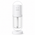 White humidifier with clear water tank on a white background