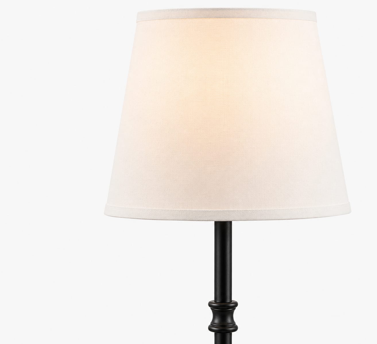 Table lamp with a white shade and black base on a white background
