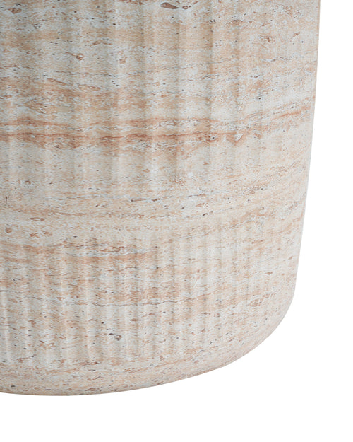 Close-up of a textured ceramic vase on a white background