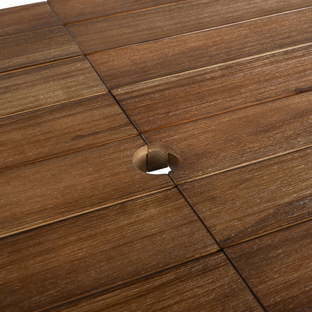 Close-up of wooden deck tiles with a screw hole