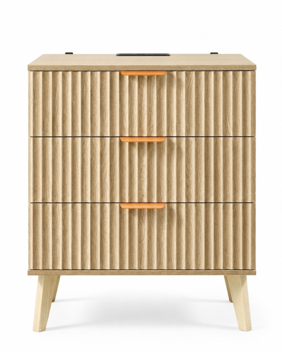 A mid-century modern three-drawer nightstand with a fluted wood front, tapered wooden legs, and small orange accent handles, shown on a white background.