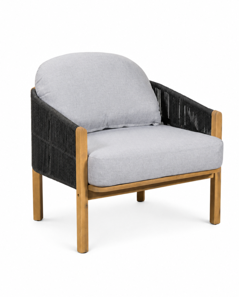 A modern accent chair featuring a light gray fabric seat and back cushion, a black woven armrests, and a natural wood frame and legs, shown on a plain white background.