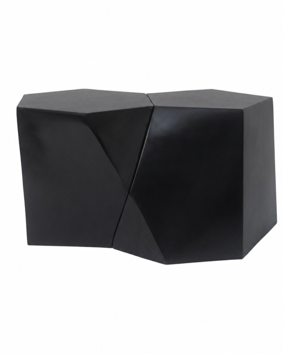A modern black geometric side table or stool with a faceted, multi-sided design, shown on a plain white background.