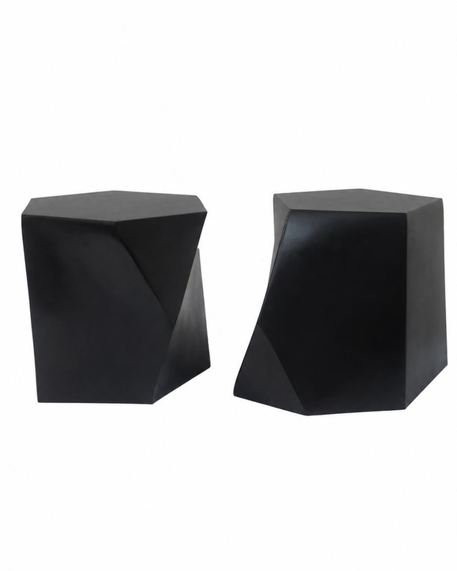 Two modern black geometric side stools with faceted, angular surfaces, shown on a plain white background.