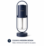 Navy blue humidifier with clear water tank on a white background